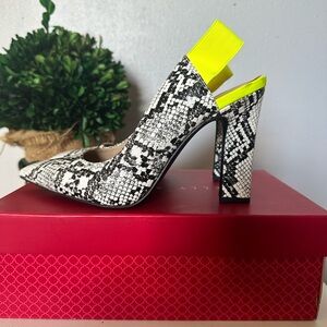Beautiful Snakeskin print pumps with a pop of color. Statement piece all outfits